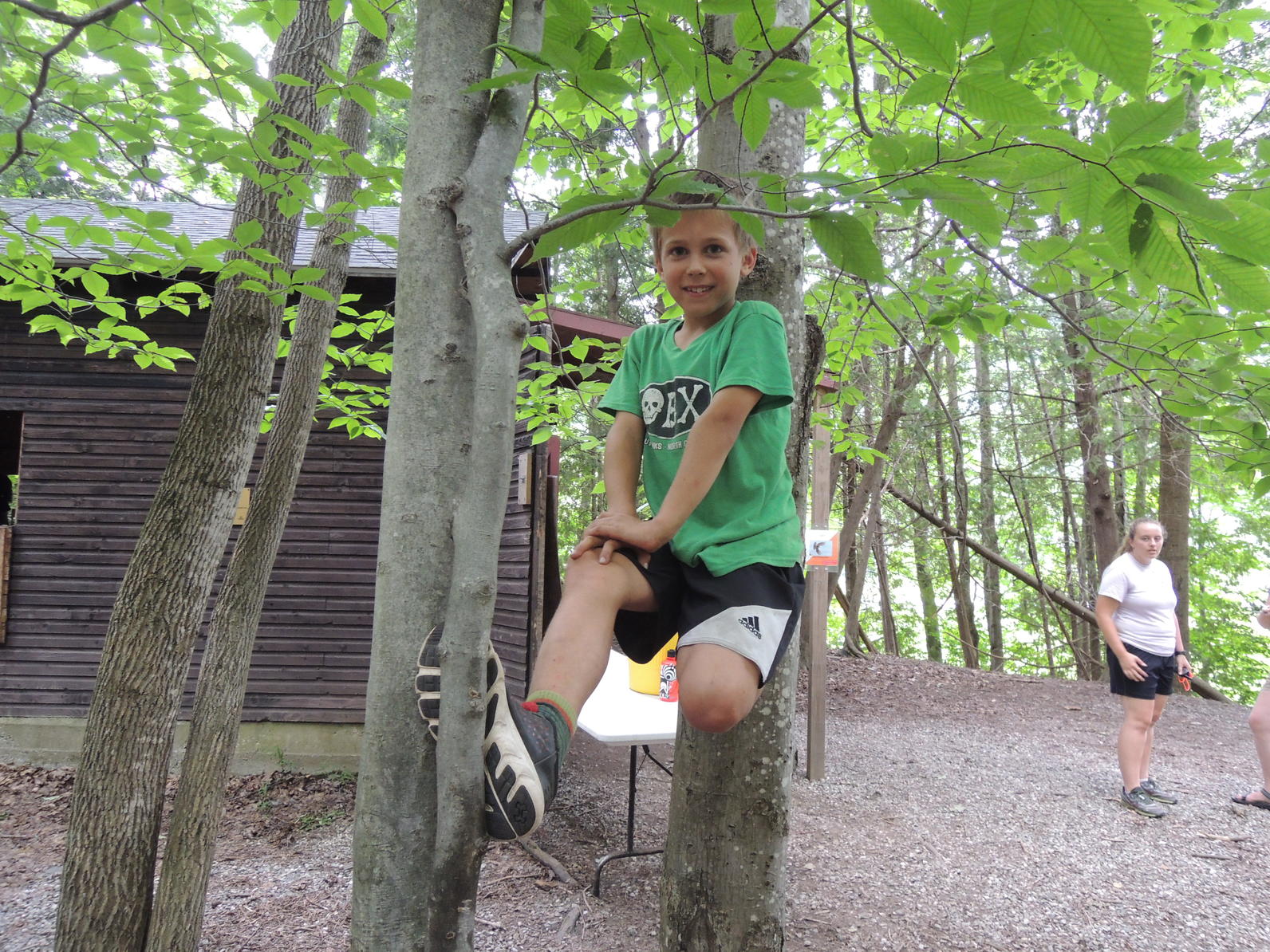 Camper climbing at camp Camper climbing at camp
