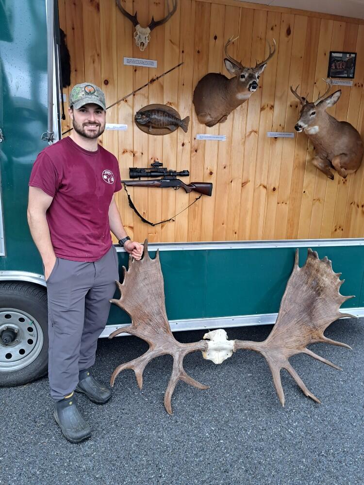 The Operation Game Theif trailer at Dead Creek Wildlife Day, featuring illegally poached White Tail Deer mounts and Moose antlers.
