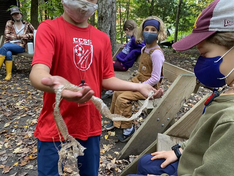 Student showing snake skin Student showing snake skin