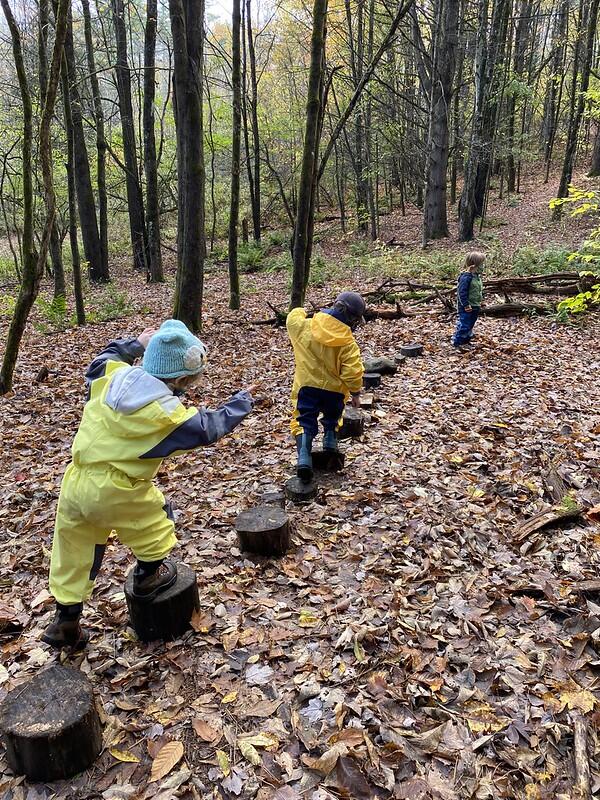 students on log obstacle course