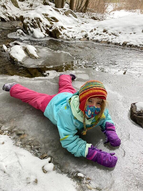 Student on ice at the brook