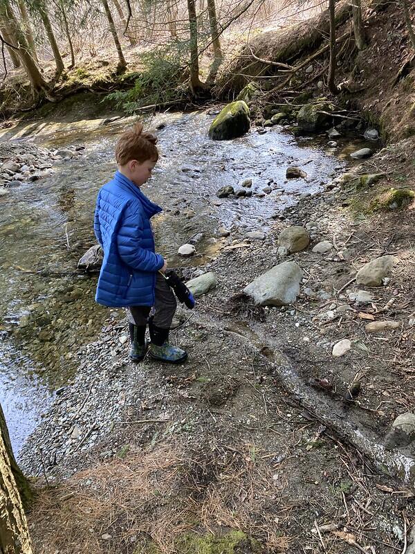 Student watching the trench drain water