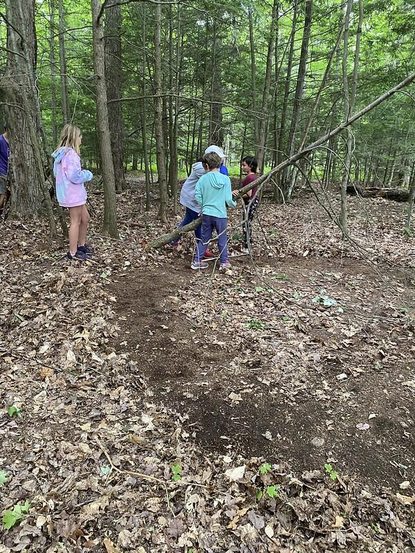 campers building a shelter