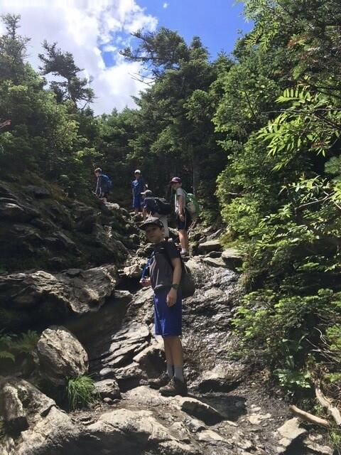 Campers hiking up Camel's Hump