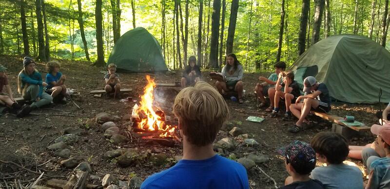 Campers around fire for campout