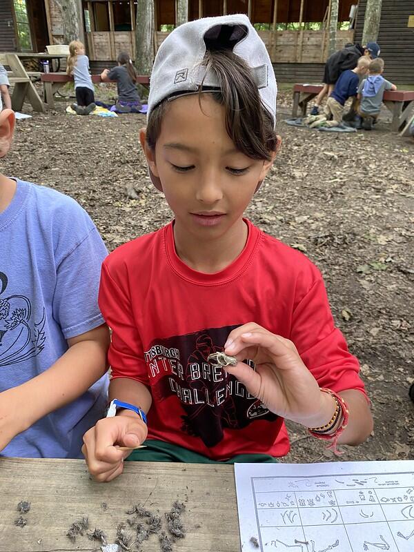 Student Holding skull from owl pellet