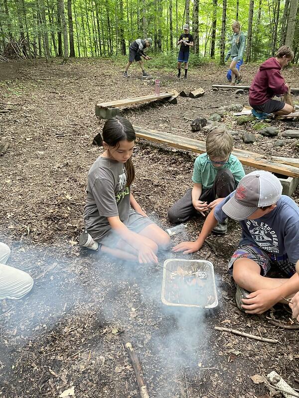 campers lighting their fires