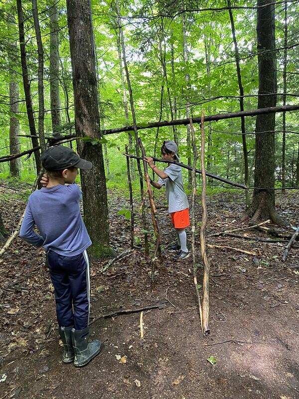 Campers working on their shelters