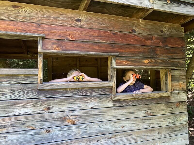 Two students in the Bird Blind with Binoculars
