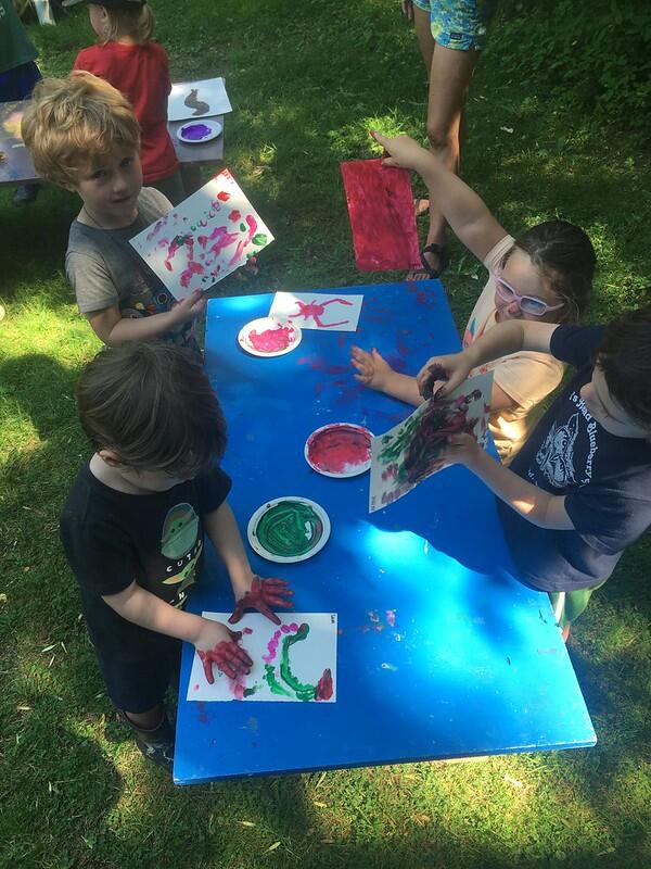Campers finger painting critters
