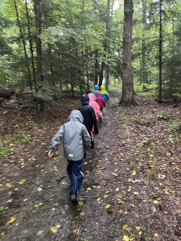 Students hiking in rain