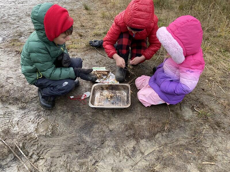 Students working on fire building