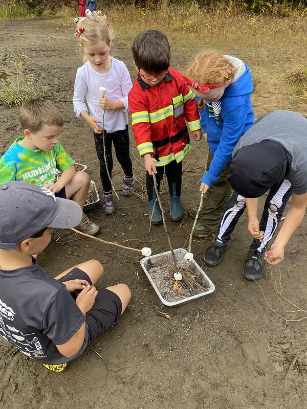 Students roasting marshmallows