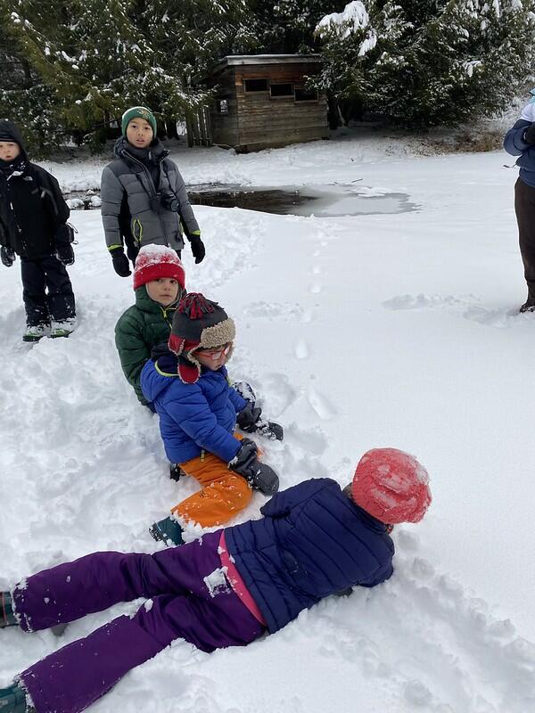 Students on pond following tracks