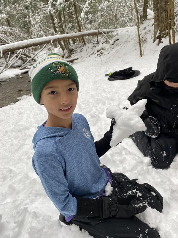 Student holding snow