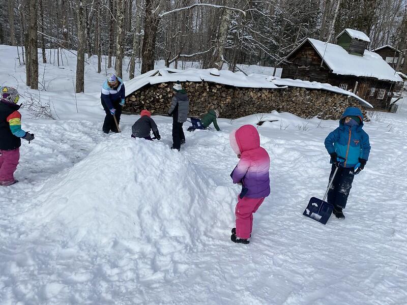 Students building snow pile
