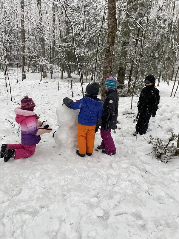 Students building snowman
