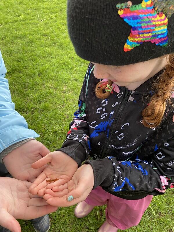 student holding red eft