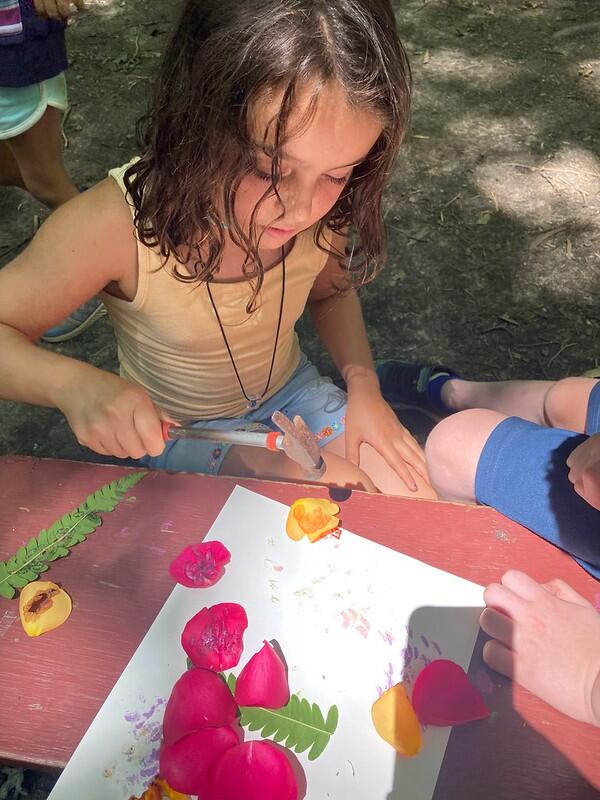 student laying out flowers