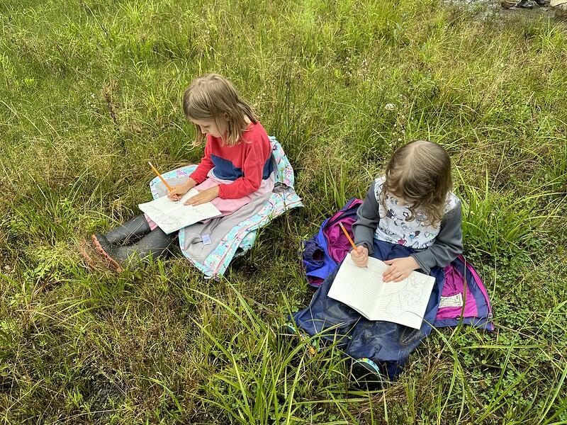 two students journaling