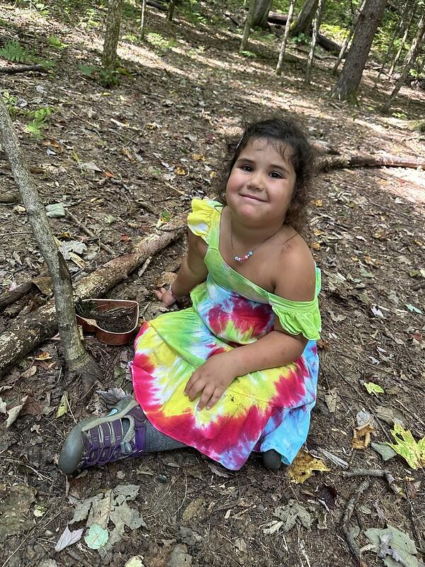 student with Mud kitchen