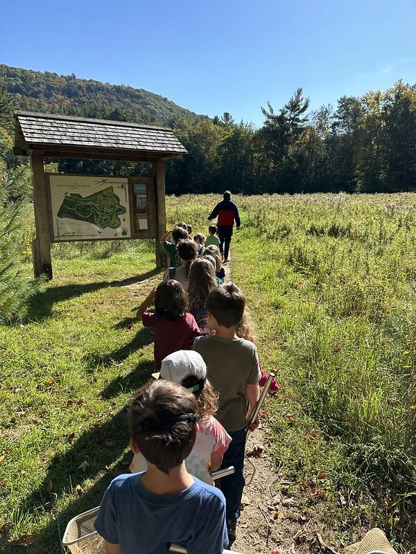 Students hiking in a field