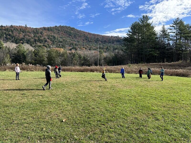 Student playing a game in the field