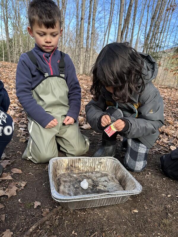 Students lighting a match