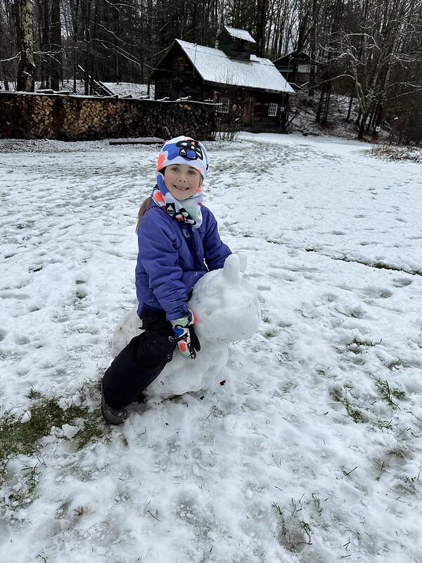 student on her snow horse