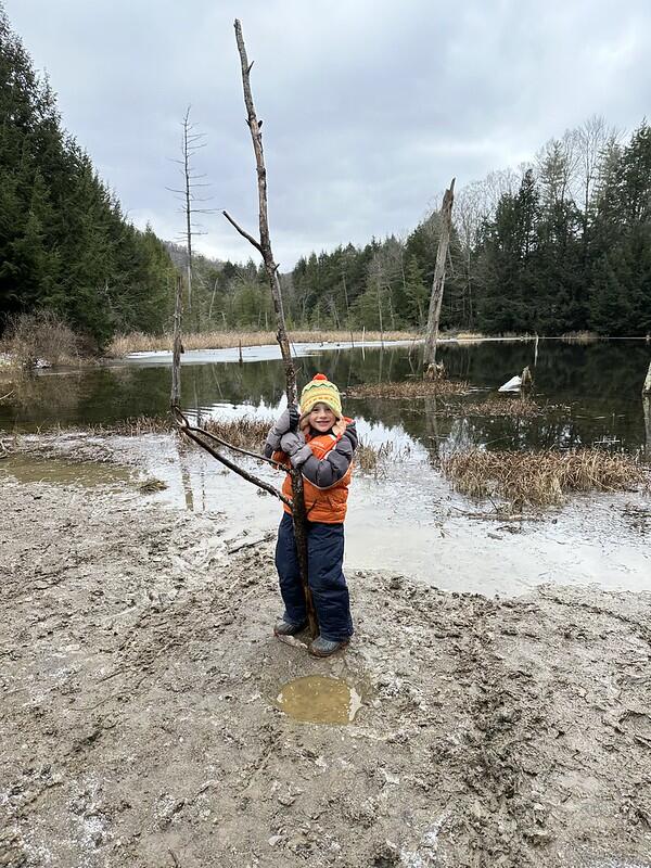 Student holding a big stick