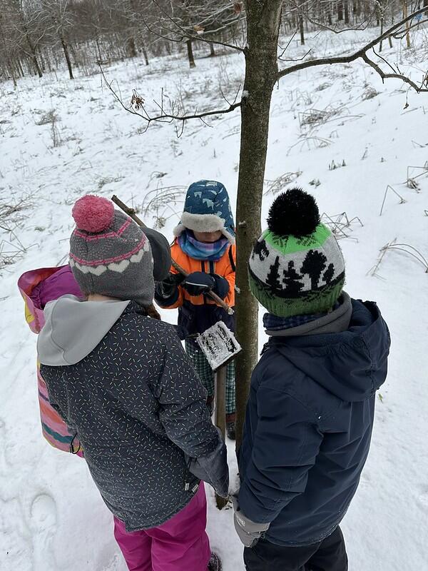 students looking at sign