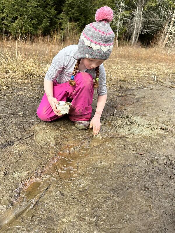 student in mud