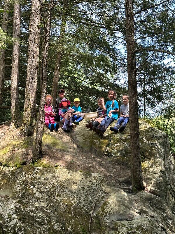 group on rock at the brook