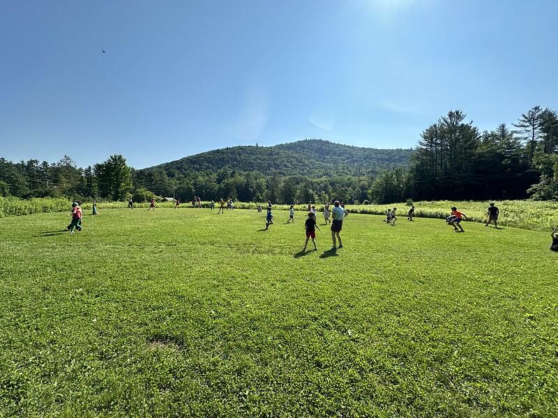 campers running in the field