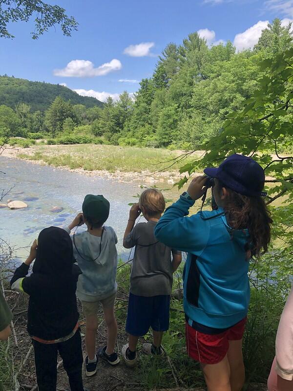 Campers looking through binoculars