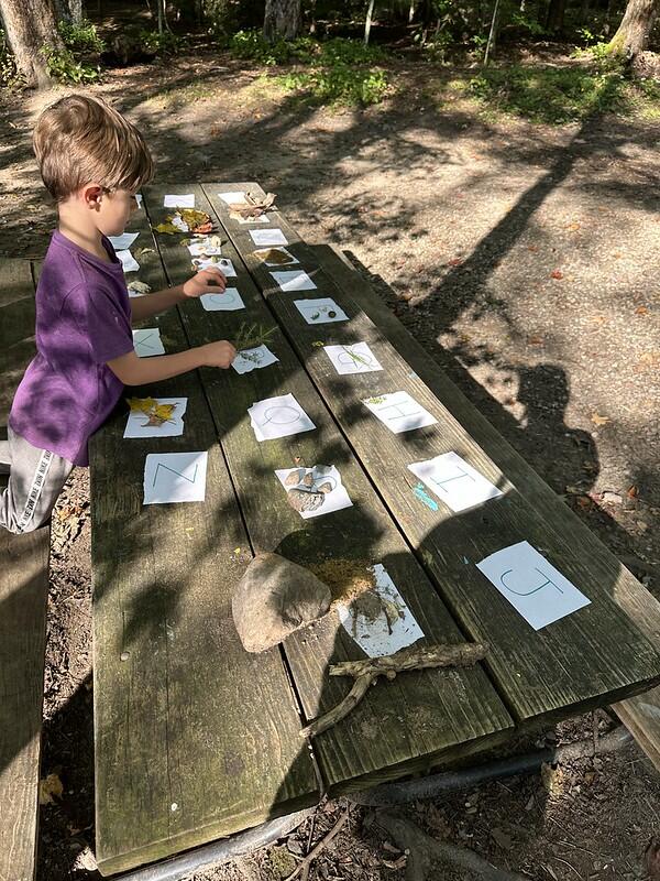 student at picnic table