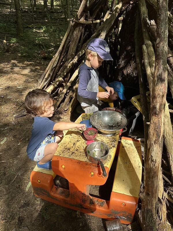 students playing in the mud kitchen