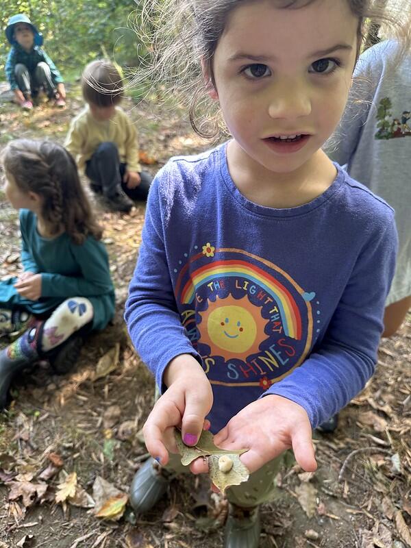 student with caterpillar