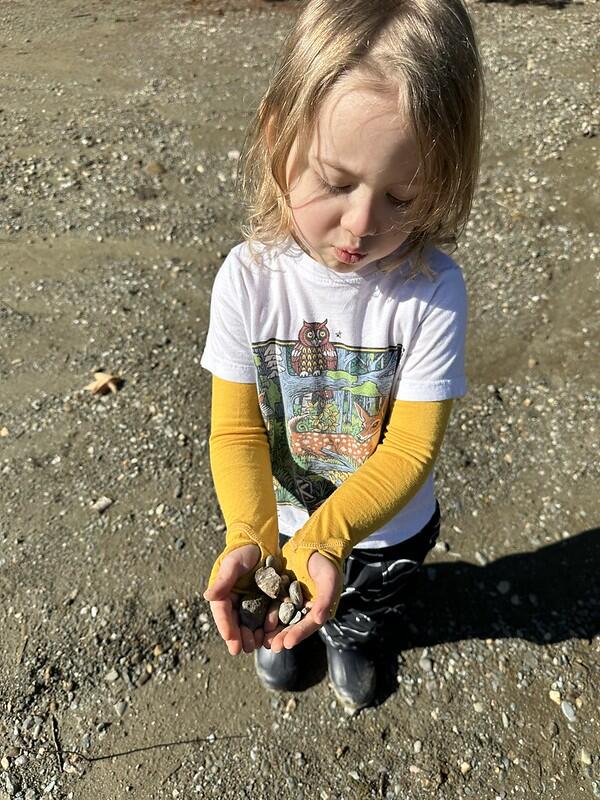 student holding rocks