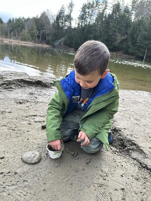 student playing in mud