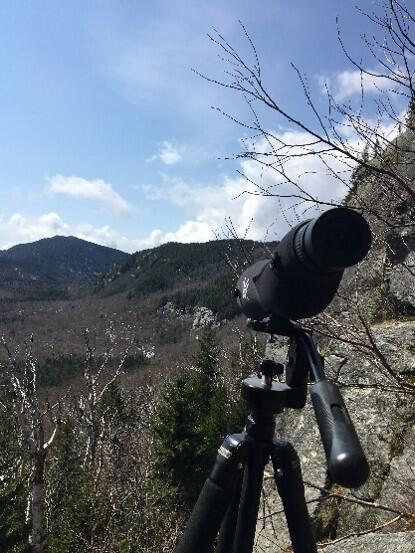 A birding scope trained on a cliff side in the Green Mountains
