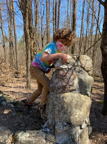 Climbing the rock wall.