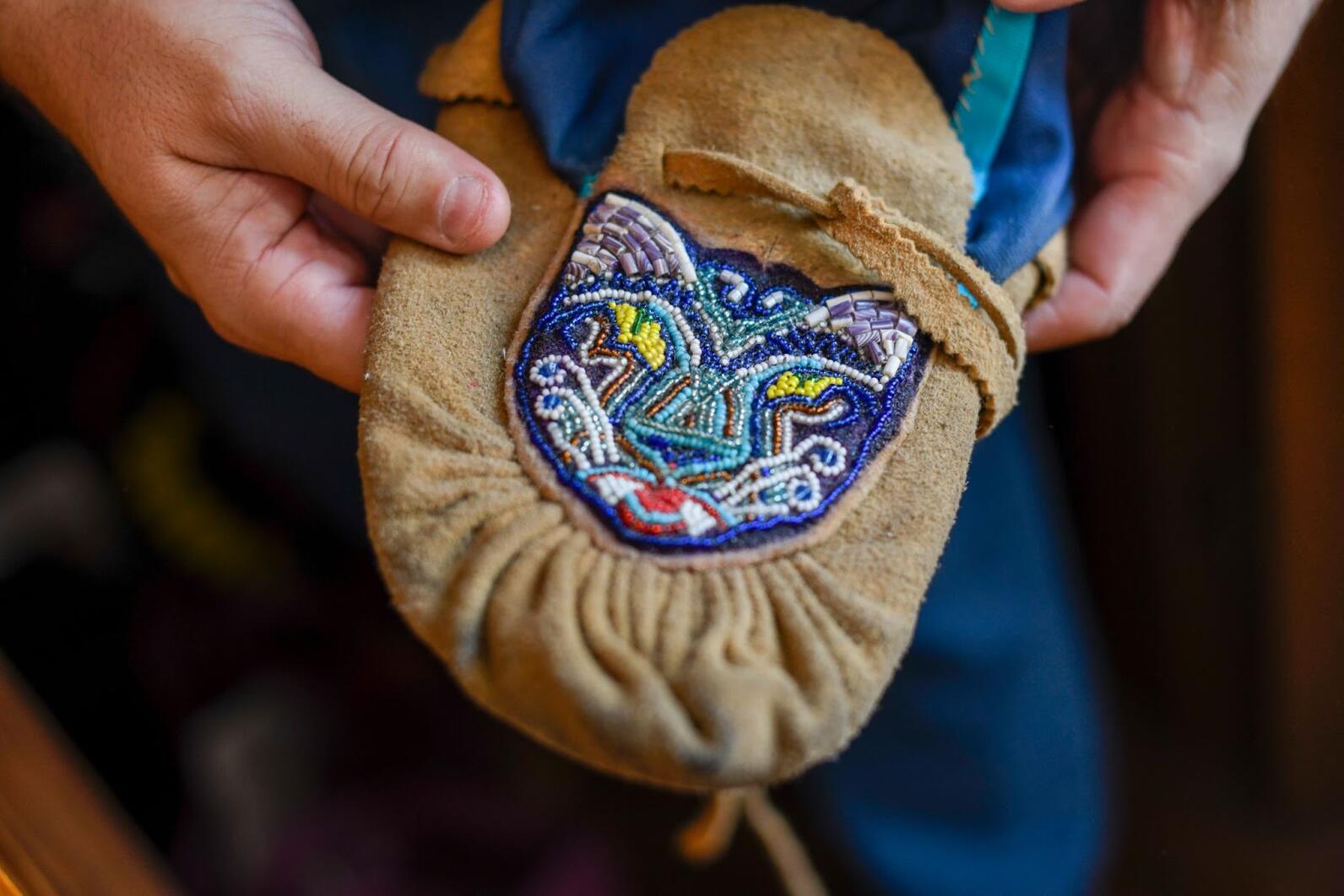 A traditional beaded pattern held by Chief Don Stevens of the Nulhegan Band of the Coosuk Abenaki Nation. Photo courtesy: Caleb Kenna Photography 