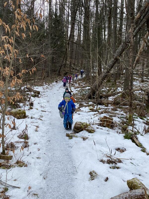 Children walk down a path