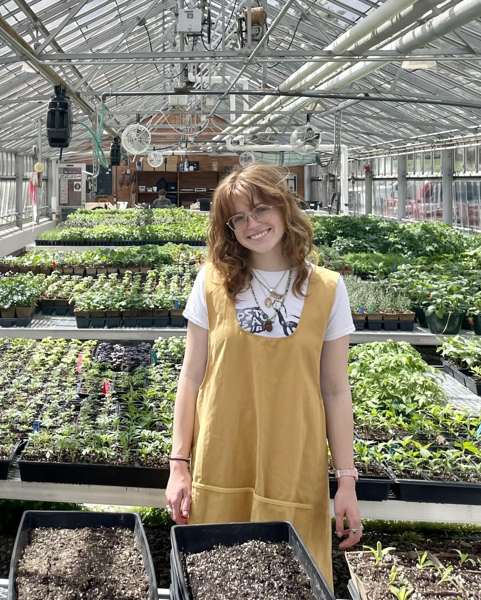 Emma standing in a garden