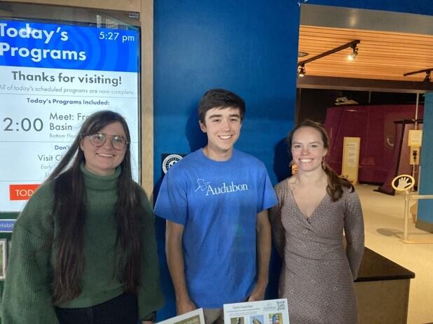 Audubon Vermont staff standing in front of their table at the Echo Leahy Center