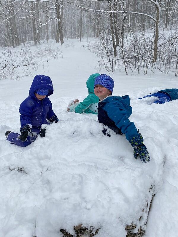 a child smiles in the snow