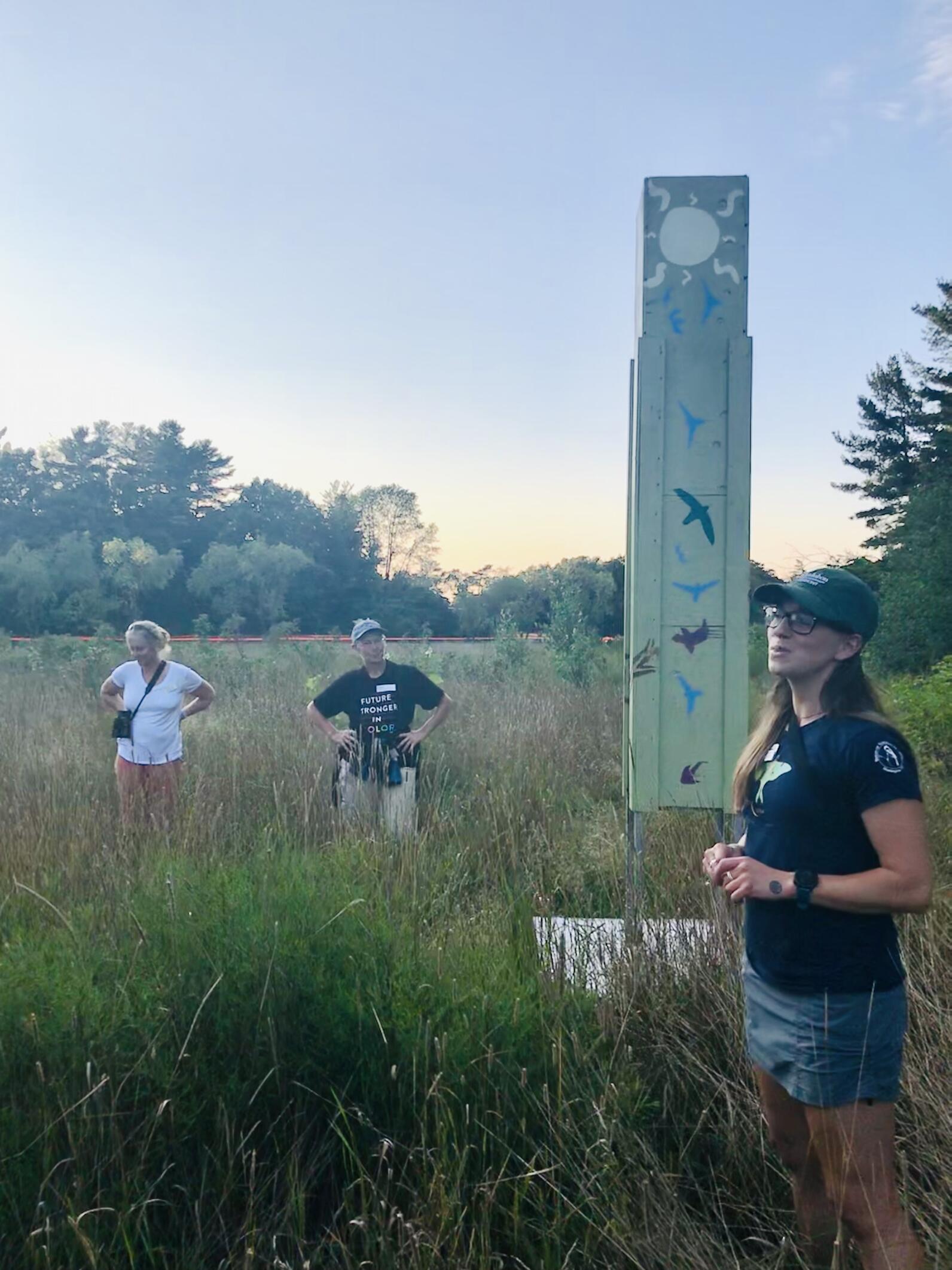 Rae Bronenkant, an educator with Audubon Vermont stands in front of the Oakledge Park Chimney Swift tower to explain how it functions in the wetland.