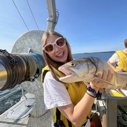 Evelyn holding a Lake Trout