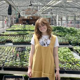 Emma standing in a garden